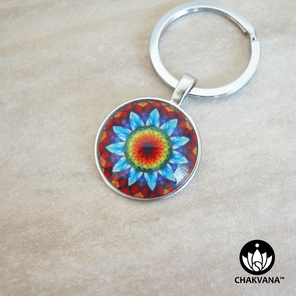 Keychain ring showcasing a vibrant Flower Mandala design inside of a magnifying glass cabochon. – Chakvana.com