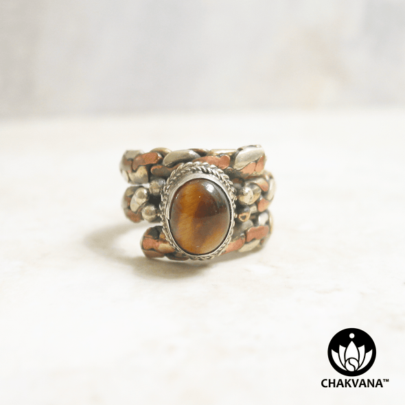 Ring with polished Tiger's Eye oval gemstone and decorative braided multi-metal ring band. – Chakvana.com