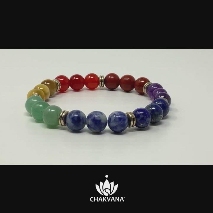 Video of 7 Chakras Bracelet. Bracelet has 7 sets of round gemstone beads, 3 beads per set, and each set represents one of the 7 major chakras. The sets of beads are separated by silver spacer beads. Chakra healing bracelet. Reiki charged. Premium Yoga Jewelry. Hand made in the U.S.A. by CHAKVANA.